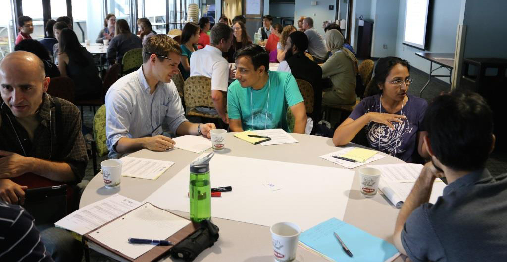 Students pair up during an activity in the 2013 INSPIRE conference, focused on equipping graduate students with new teching techniques.