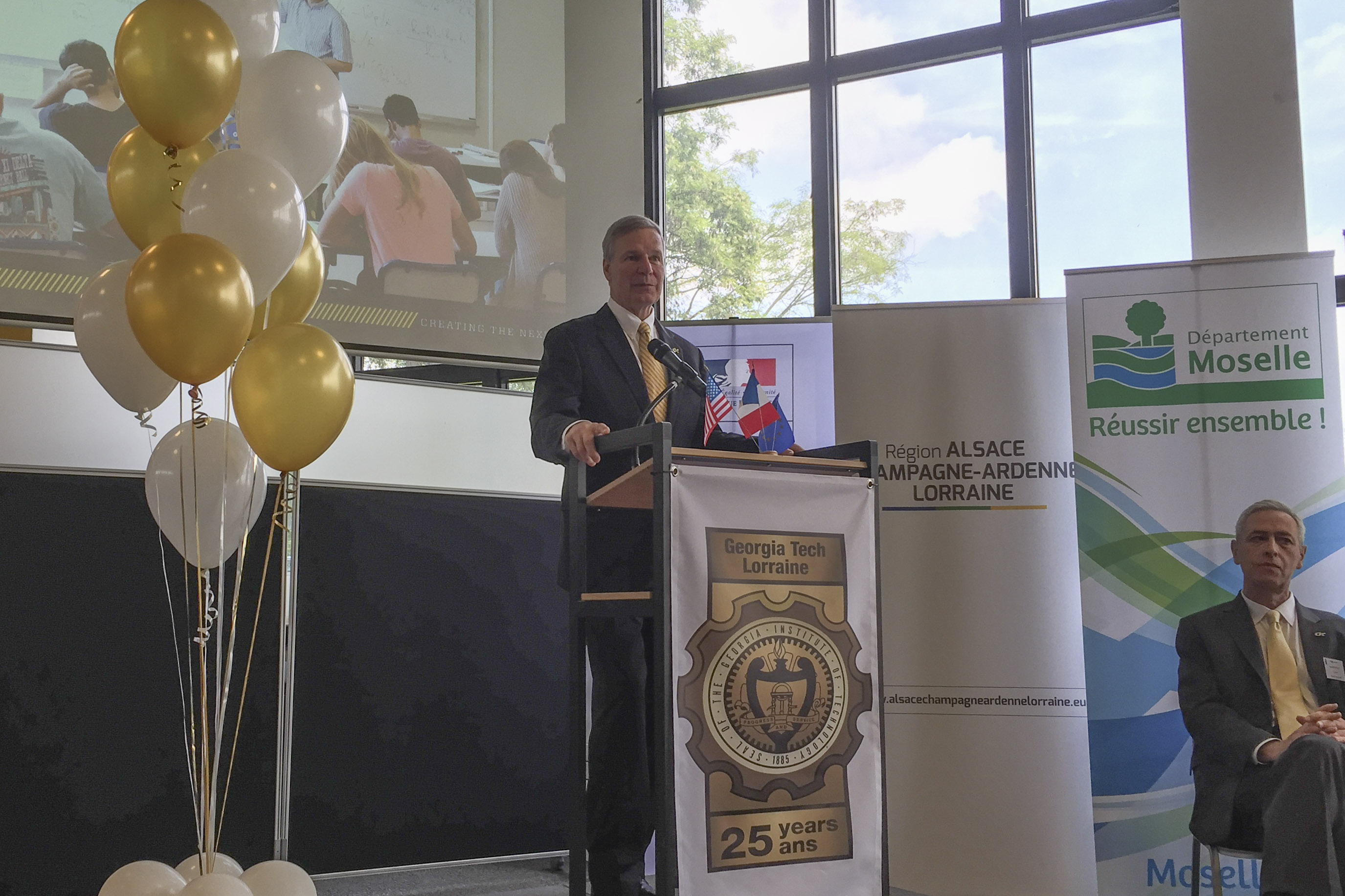 Georgia Tech President G.P. "Bud" Peterson offers remarks at the 25th anniversary of Georgia Tech-Lorraine in Metz, France. Yves Berthelot, vice provost for international initiatives, looks on.