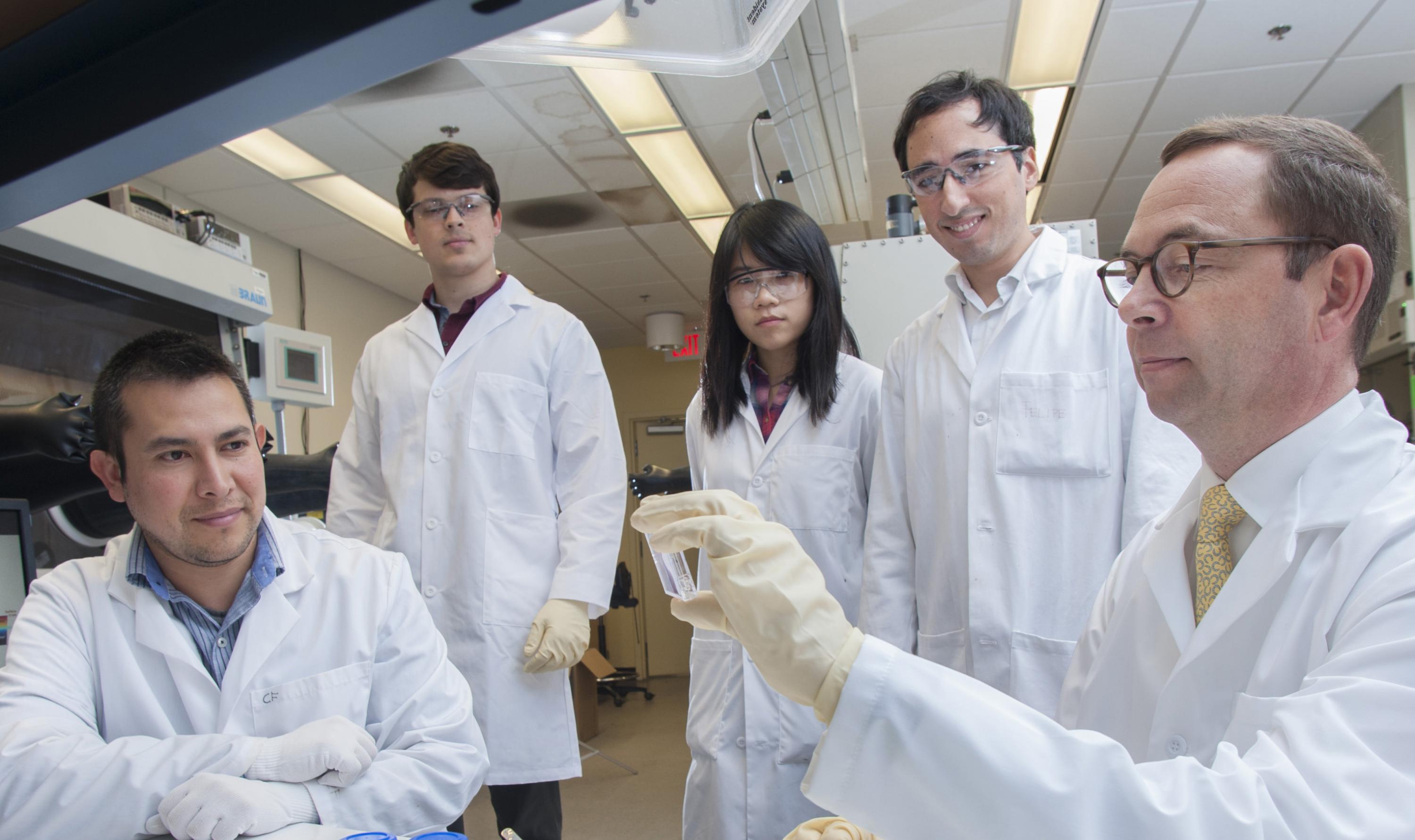 The leading team of scientists at Georgia Tech that developed the new solution-based electrical doping technique for organic semiconductors. Shown are (l-r) senior research scientist Canek Fuentes-Hernandez; graduate students Vladimir Kolesov, Wen-Fang Chou, Felipe Larrain; and professor Bernard Kippelen.  (Credit: Christopher Moore, Georgia Tech)