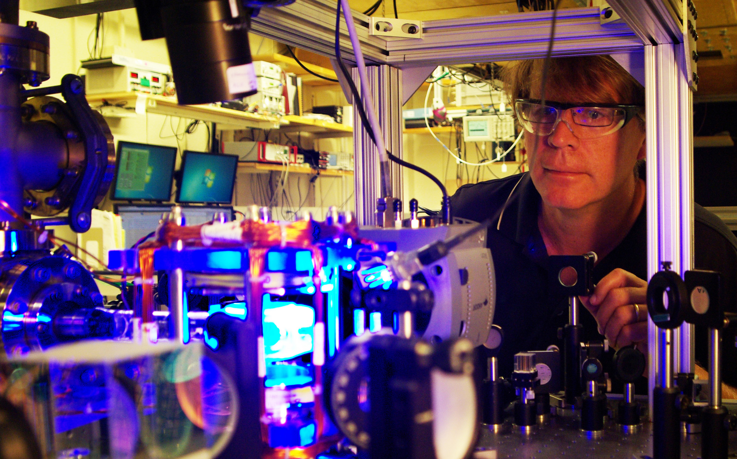 Researchers have demonstrated a way to maintain an unstable quantum system by applying bursts of microwave radiation.Georgia Tech professor Michael Chapman poses with laser equipment in his laboratory. (Georgia Tech Photo: John Toon)