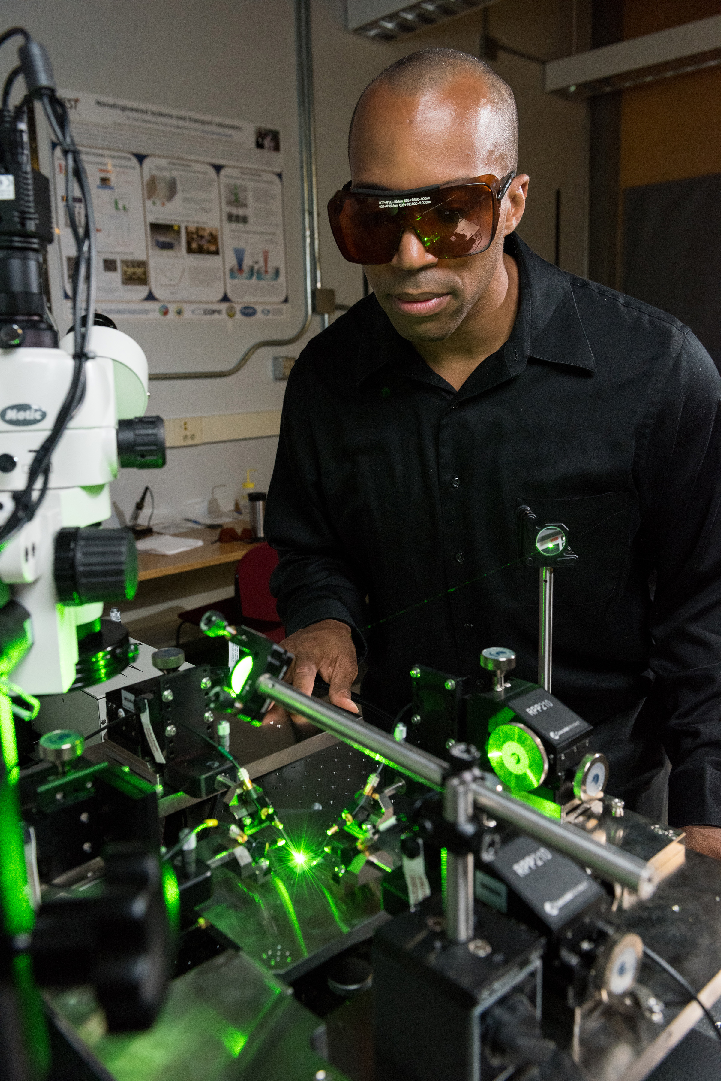Georgia Tech associate professor Baratunde Cola measures the power produced by converting green laser illumination to electricity using the carbon nanotube optical rectenna. (Credit: Rob Felt, Georgia Tech)