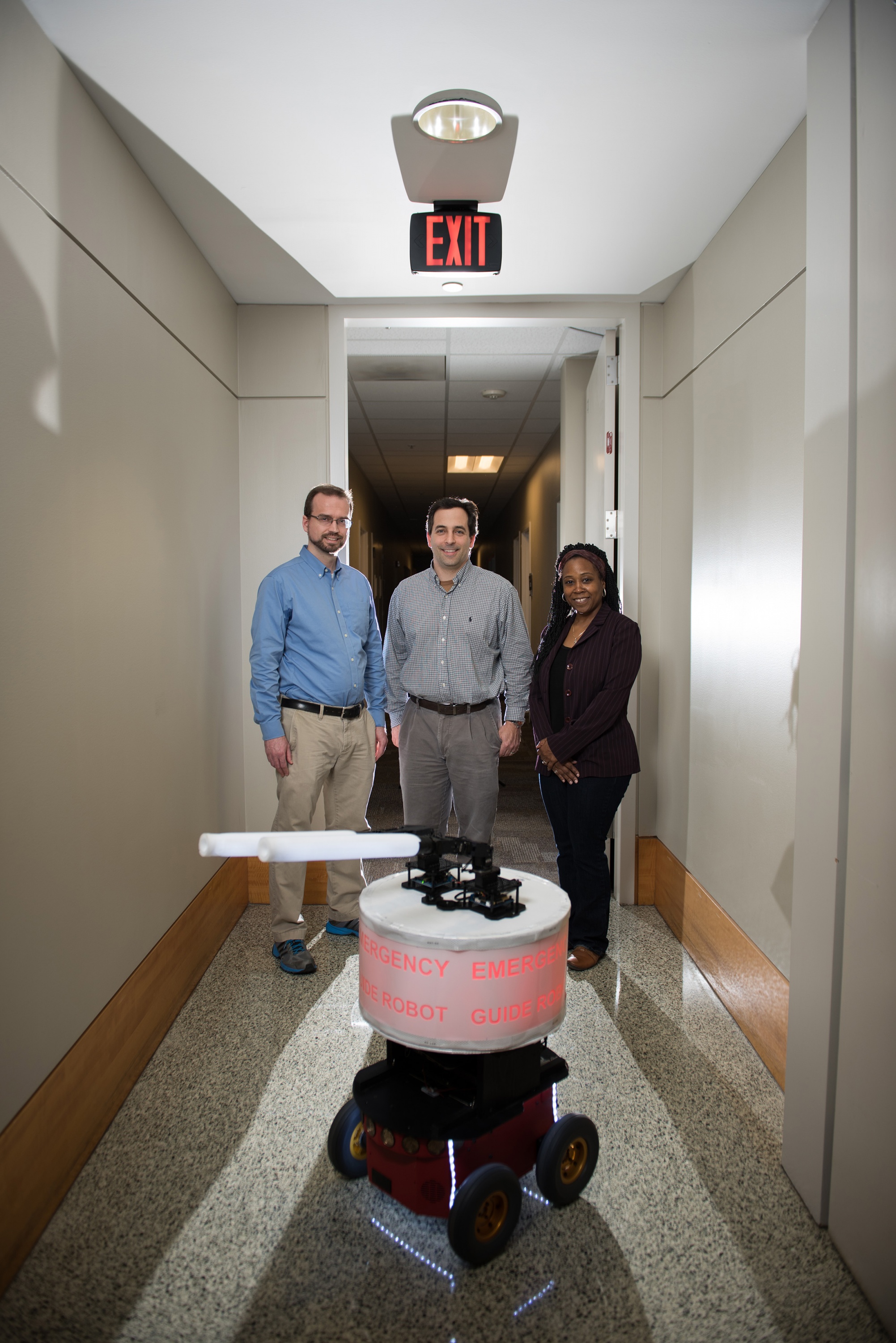  Georgia Tech researchers shown with their “Rescue Robot.” (L-R) GTRI Research Engineer Paul Robinette, GTRI Senior Research Engineer Alan Wagner and School of Electrical and Computer Engineering Professor Ayanna Howard. (Credit: Rob Felt, Georgia Tech)