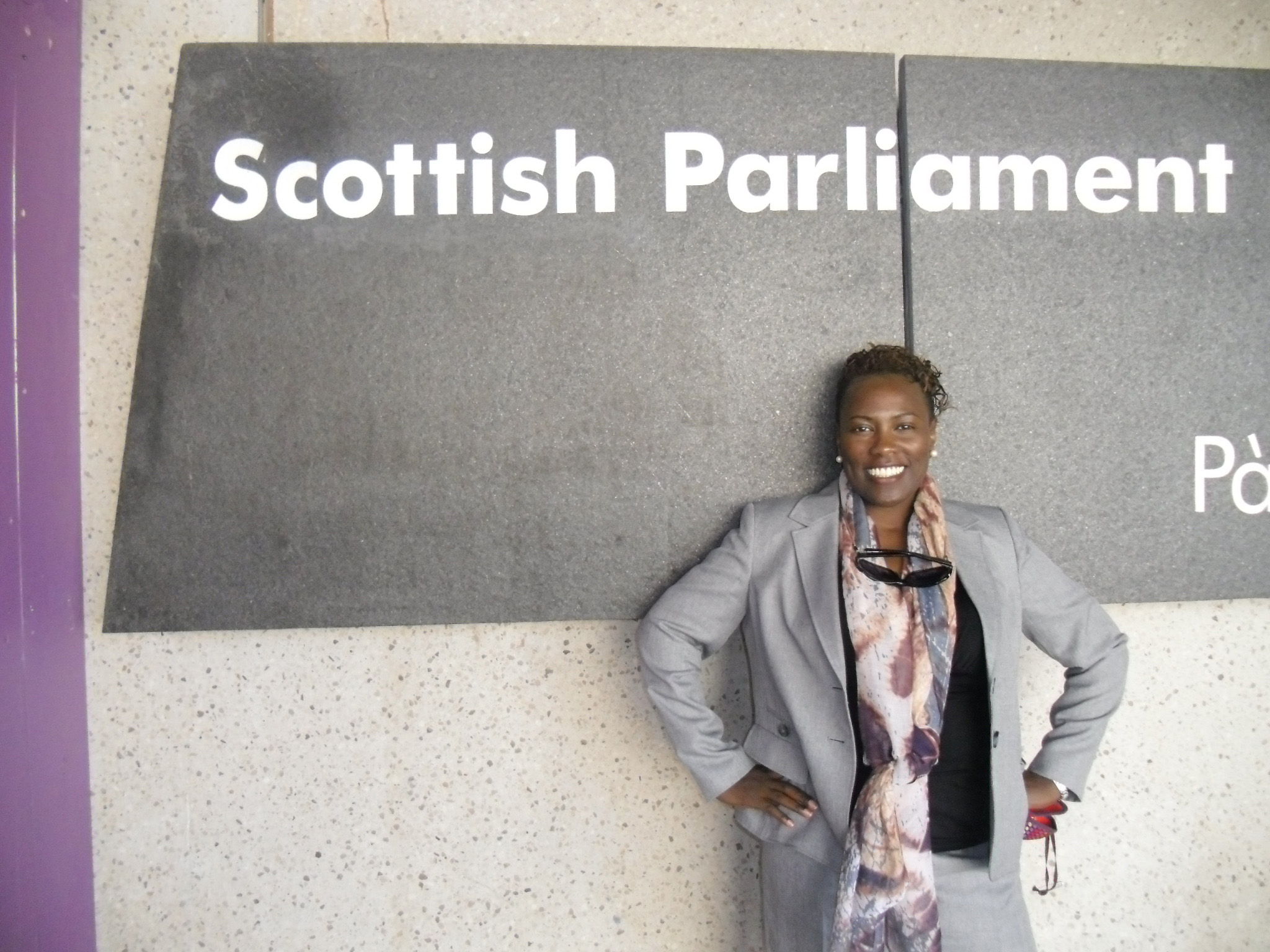 Stephanie Jackson outside the entrance to the Scottish Parliament in Edinburgh, Scotland, during her Fulbright program visit to the United Kingdom.