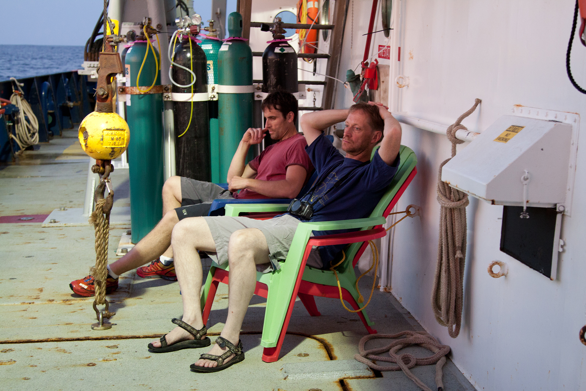 Georgia Tech researcher Frank Stewart (background) sits with the paper's co-authro, Bo Thamdrup from the University of Sourthern Denmark on a research ship that took them to an oxygen minimum zone, where they hauled up the newly discovered bacteria. Photo: Dr. Heather Olins
