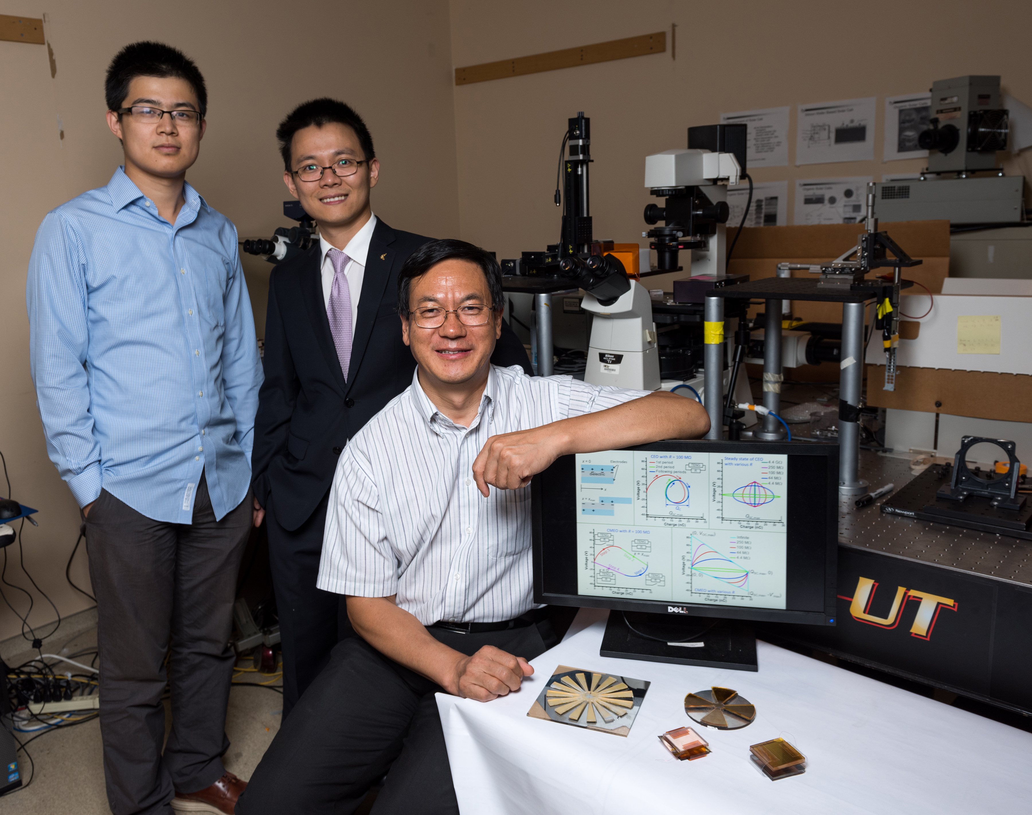 (Left to right) Georgia Tech graduate student Simiao Niu, postdoctoral fellow Yunlong Zi and Regents professor Zhong Lin Wang are shown with a selection of triboelectric nanogenerators. (Credit: Rob Felt, Georgia Tech)