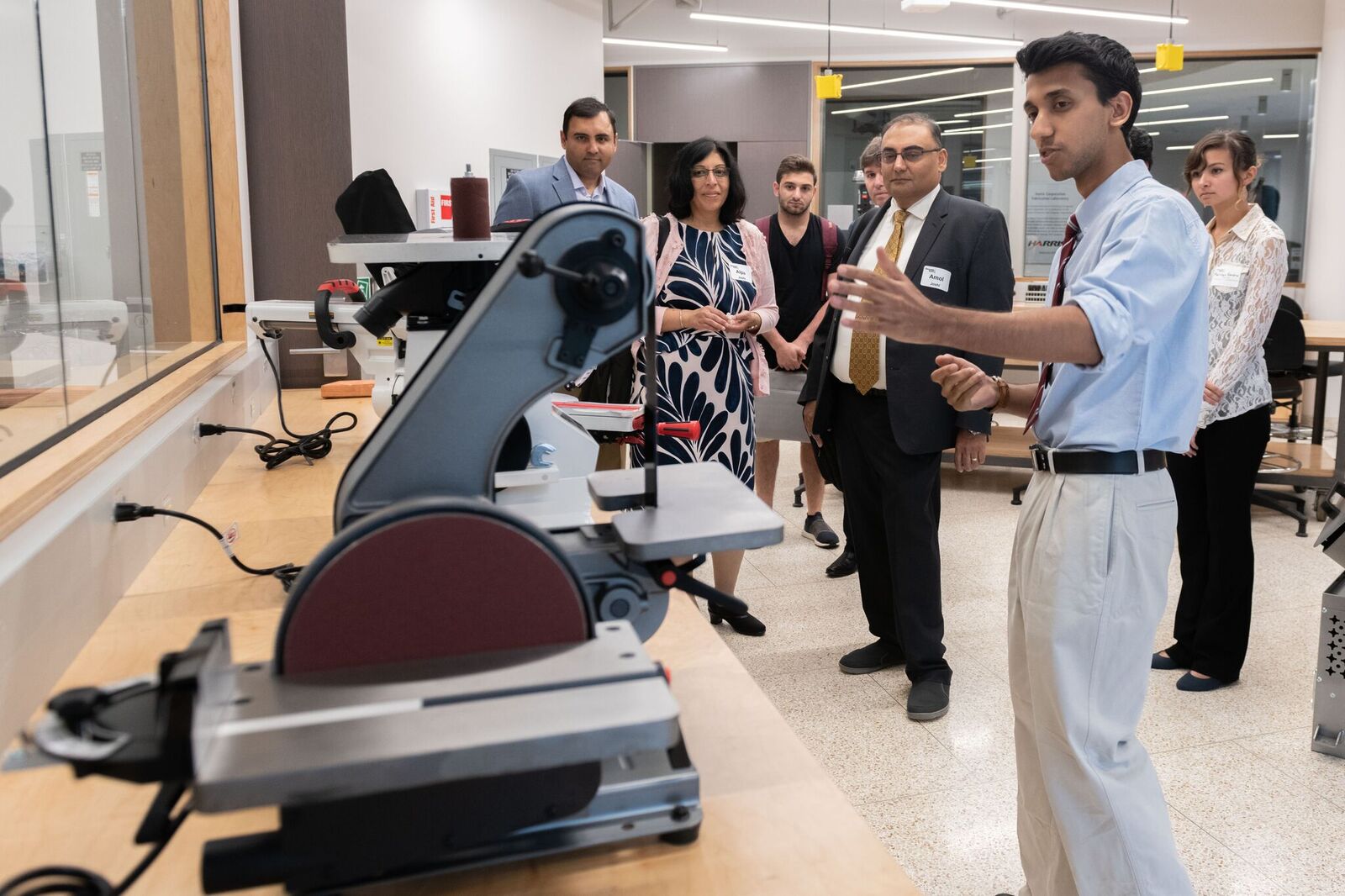 Students show donors and guests the equipment in the new Texas Instruments Makerspace in the Van Leer Building.