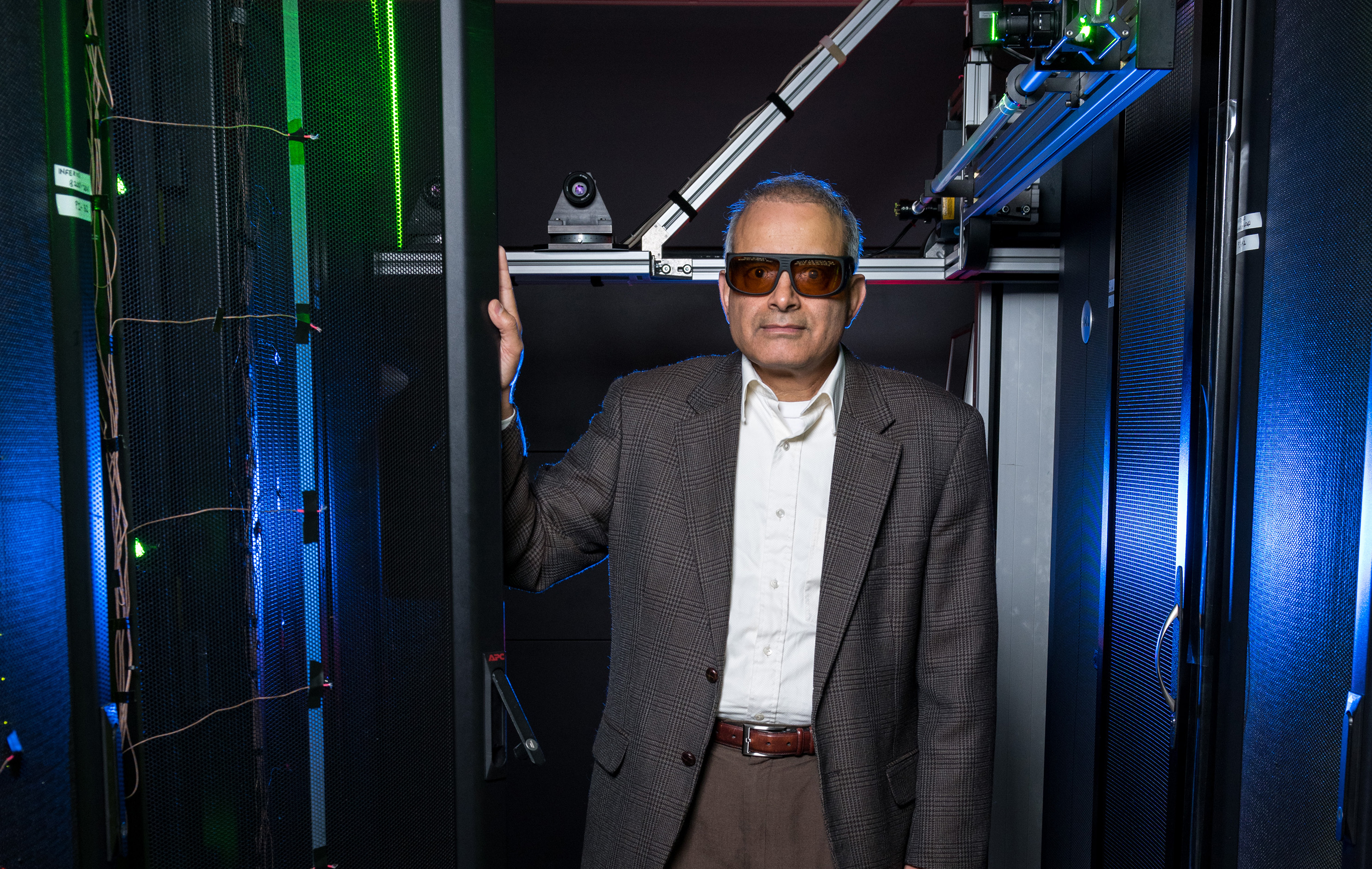 Georgia Tech’s data center simulator uses lasers, wireless sensors, and other equipment to study air flow and cooling in server racks. Shown is Yogendra Joshi, a professor in Georgia Tech’s School of Mechanical Engineering. (Credit: Rob Felt, Georgia Tech)