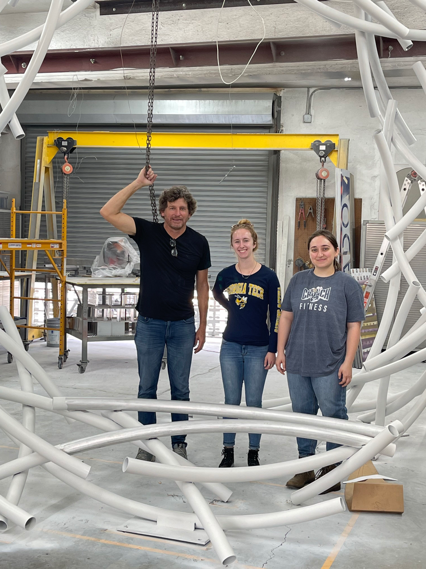 College of Design students with sculptor creating an underwater sculpture.