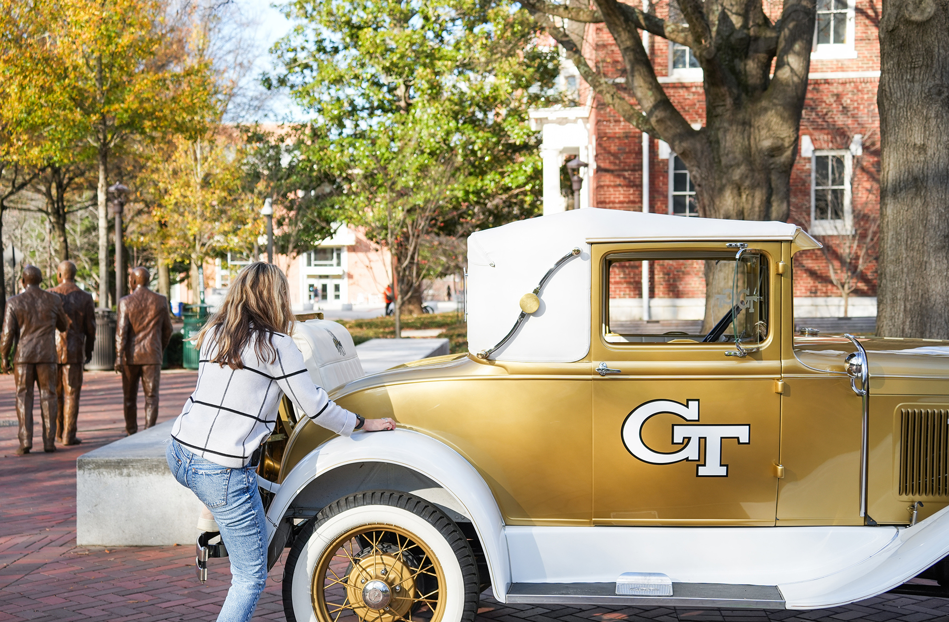 maya lachev climbs into the rumble seat