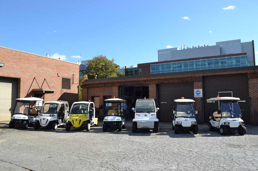 line of electric golf carts, all different styles