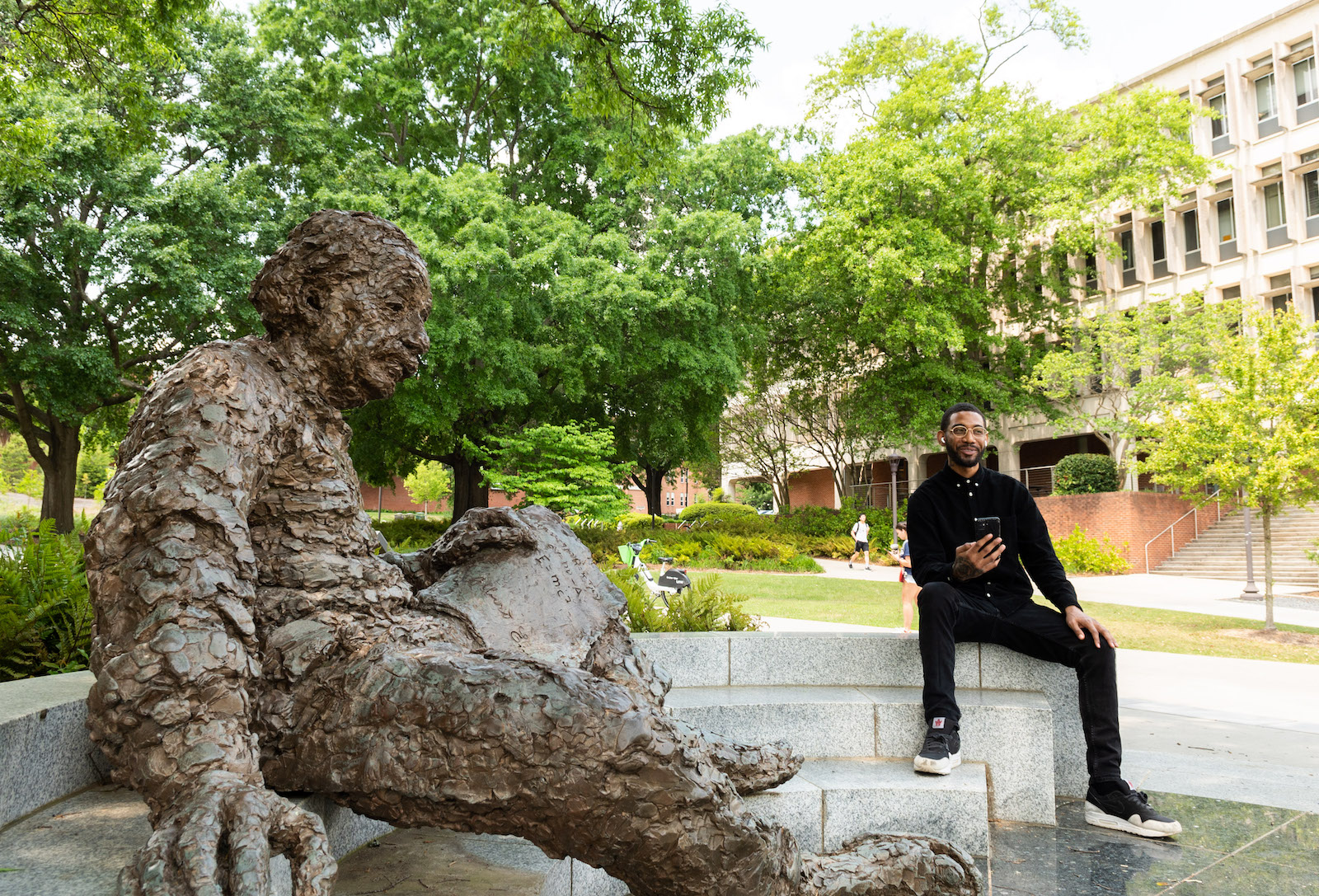 Kam Brown next to the Einstein Statue. 