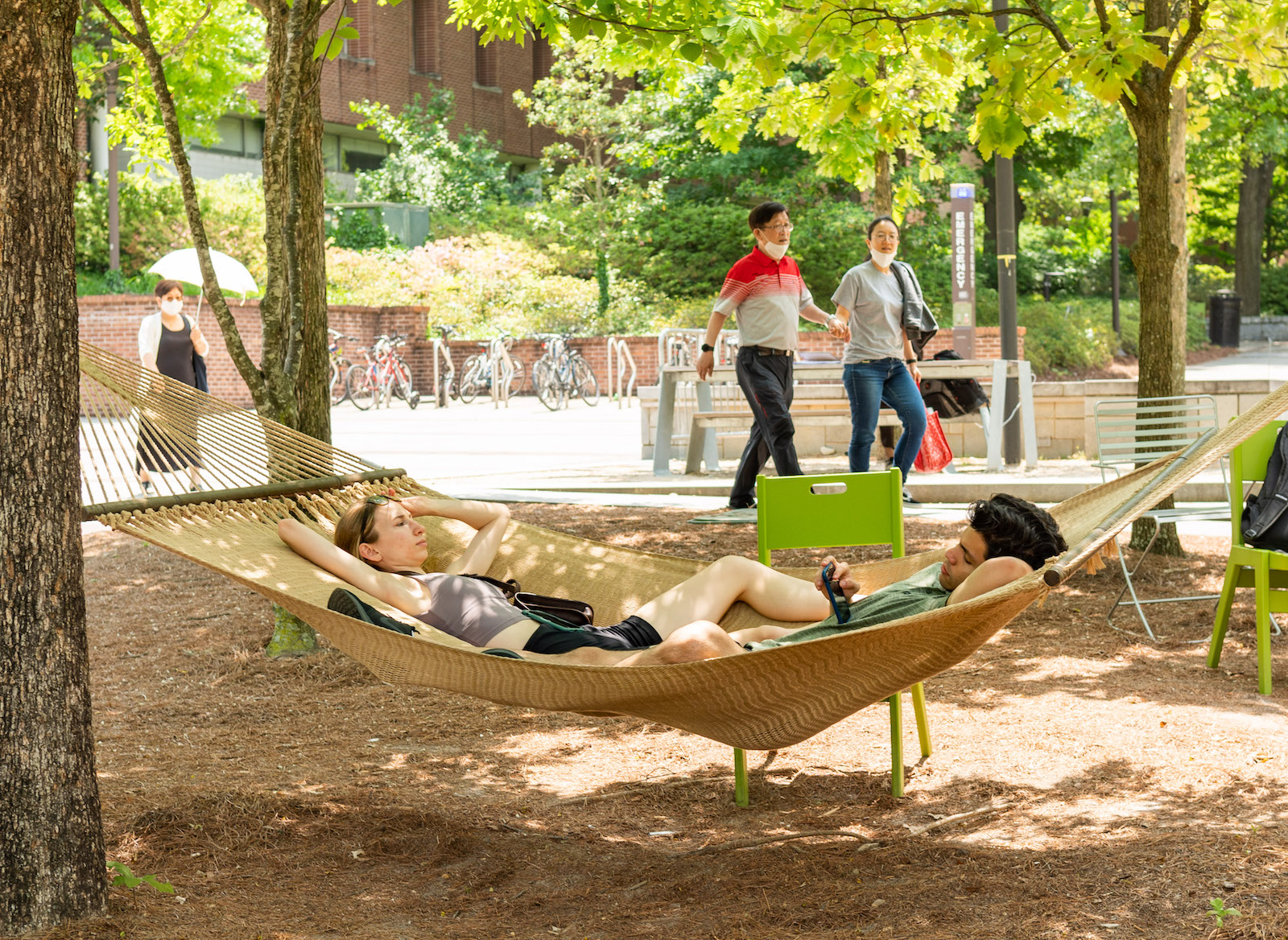 Catherine Conley and Angel Ramirez relax in a hammock on Tech Green. 