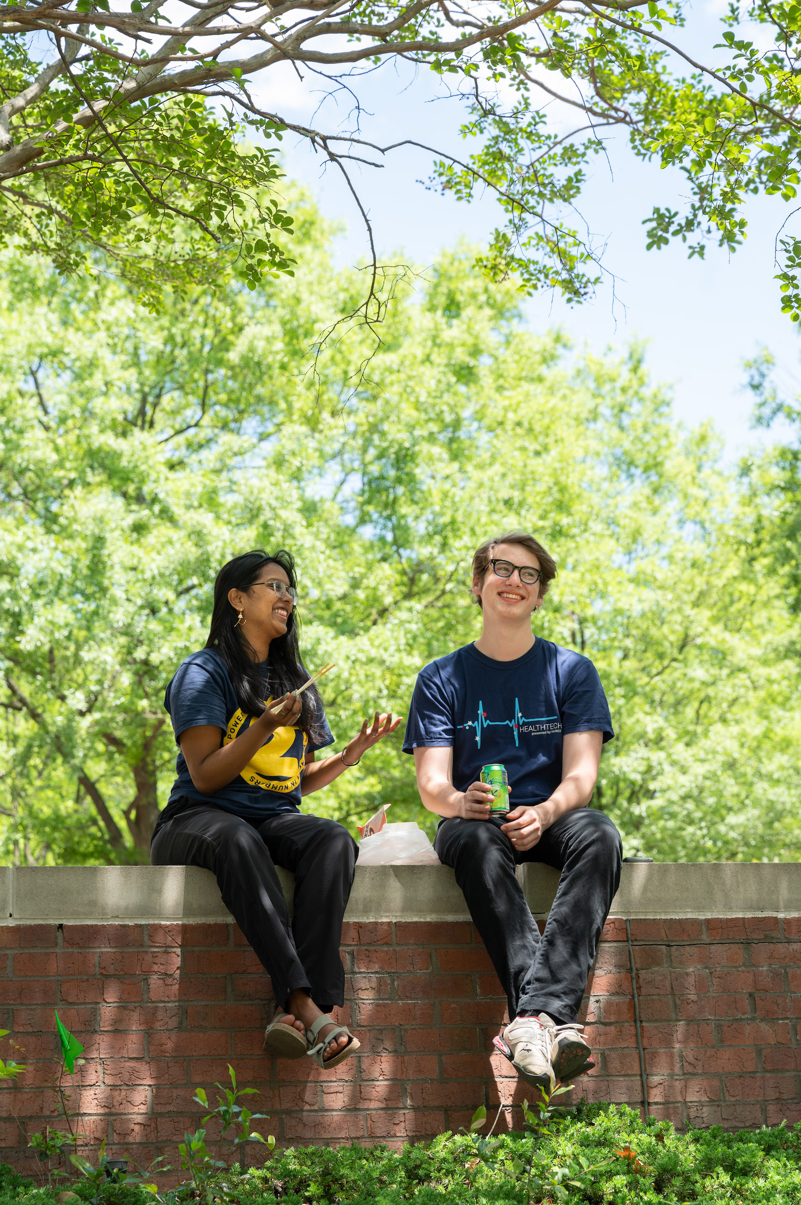 Vaishsu Adimulam and Elijah Hopper having lunch near Crecine Hall. 