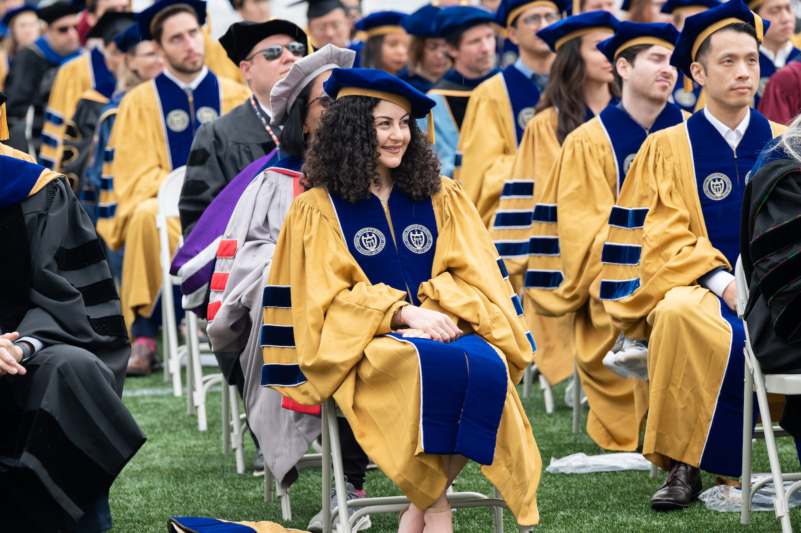 woman PhD graduate with curly hair