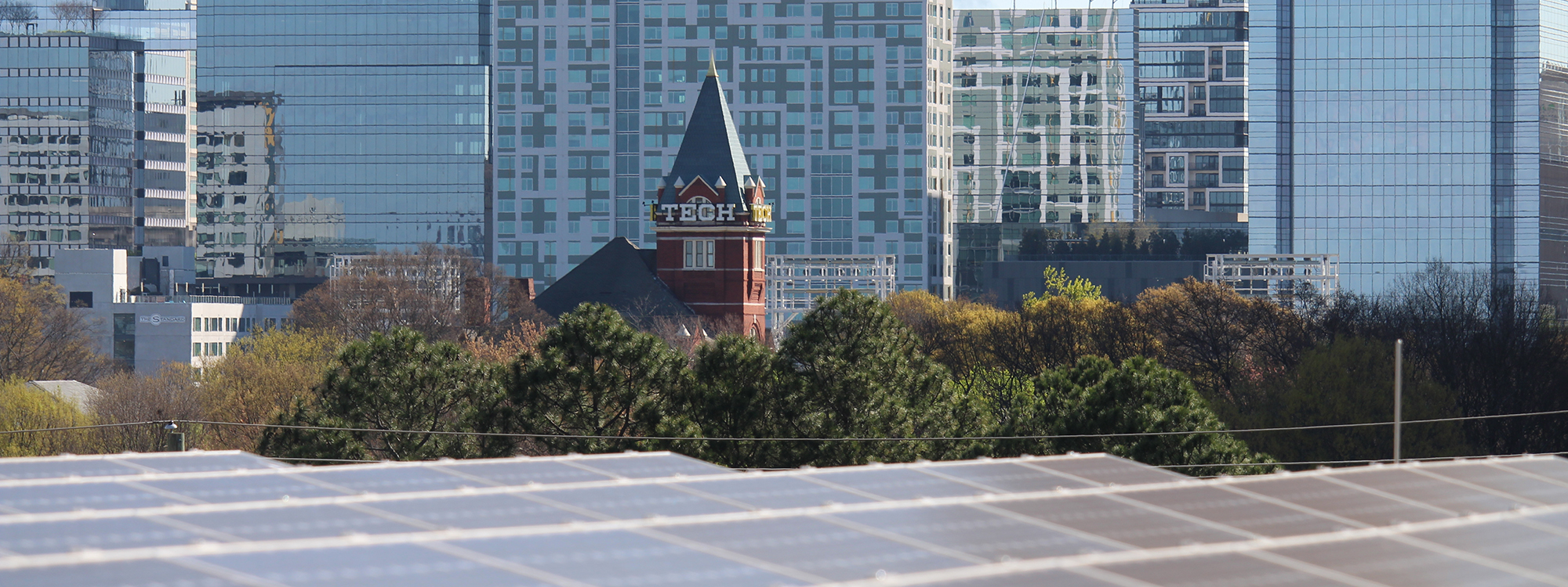 tech tower visible behind solar panels on top of the carbon neutral energy solutions laboratory - photo by steven gagliano