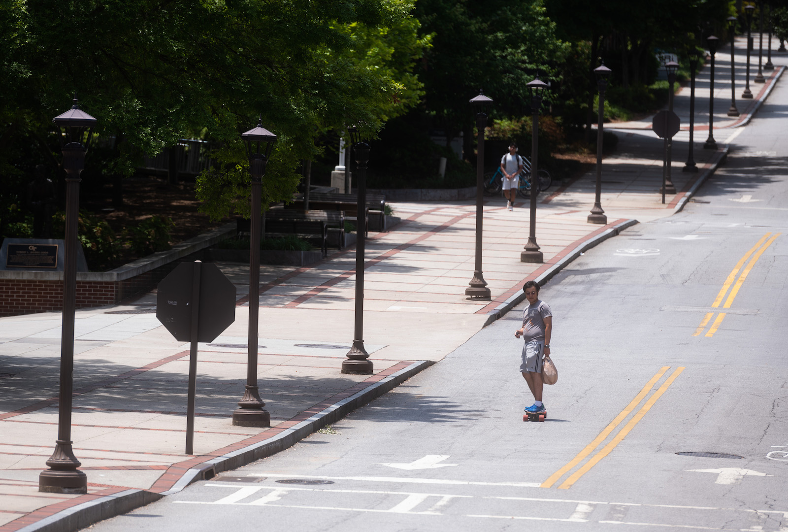 student skating down Freshman Hill