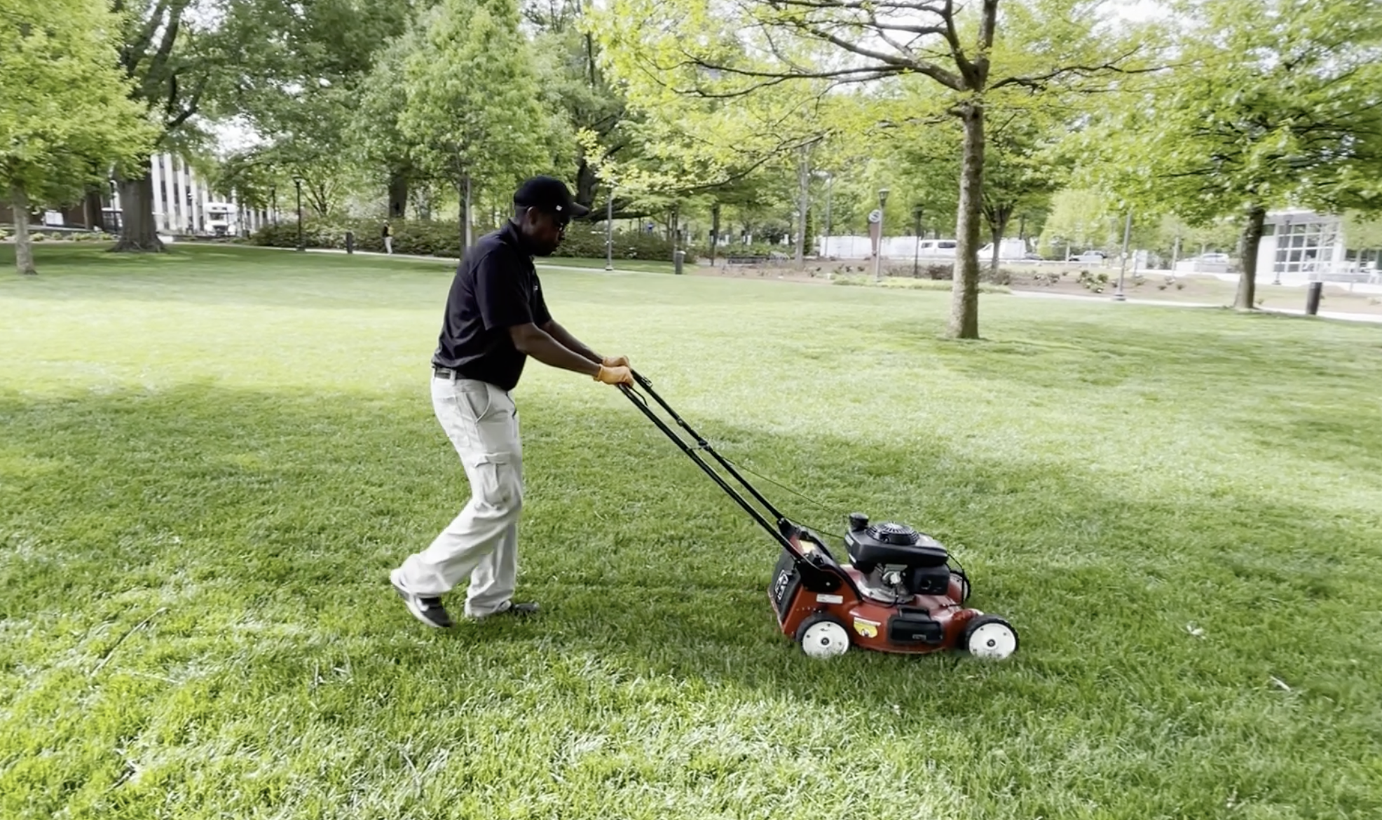 Ricky Walton, mowing on campus near the Student Center. 