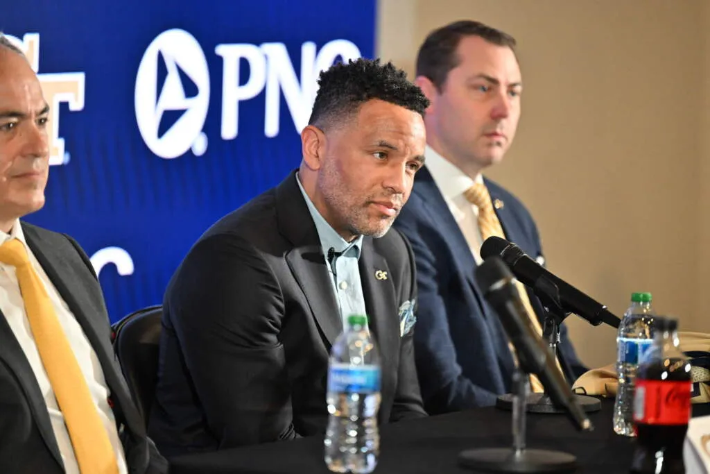 Coach Damon Stoudamire at press conference