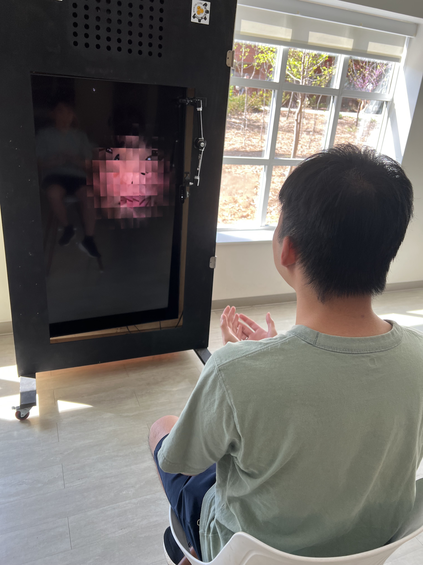 Photorhythms installation at the Ferst Center. Student having photo taken which will be manipulated into a portrait.