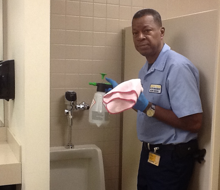 pink cloth used in restroom cleaning by custodian