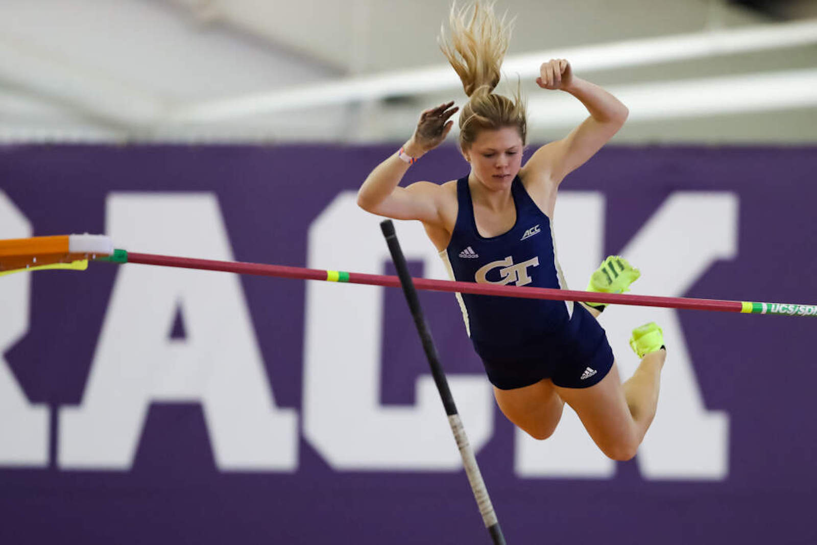 Olivia Moore competing in women's pole vault. 