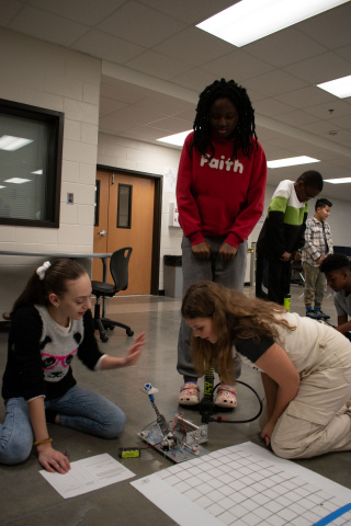 Students at Jones Middle School in Gwinnett County test the cradle they designed during the "Carnival Tycoon" design challenge. "Carnival Tycoon" is the 6th grade portion of Georgia Tech's STEM-ID curriculum.