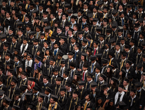graduates at commencement