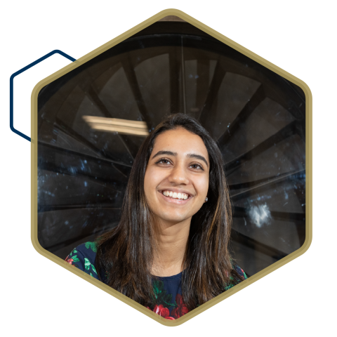 Student in front of wind turbine