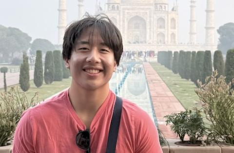 Graduating CS Major Andrew Wang outside the Taj Mahal