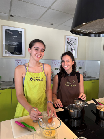 Third-year Biochemistry major Kaya McClincy and third-year Chemical Engineering major Madeline "Maddie" Murdock put the finishing touches on their entrée.