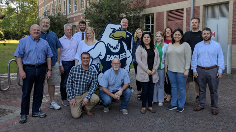 Caitlyn Wine with her program cohort in 2019