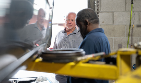 Ray Butler and an employee at Butler's Tire & Lube in Pembroke