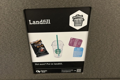 Image of updated landfill signage at campus waste stations