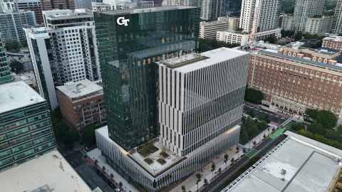 This image is a still photo from a drone hovering near the top of the new George and Scheller Towers at Georgia Tech