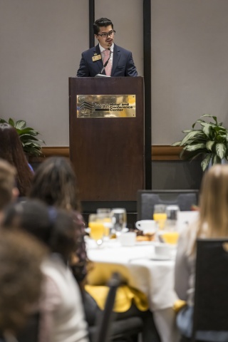 Student Andrés Robles Sotomayor speaking at a podium