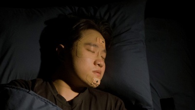  Georgia Tech Associate Professor W. Hong Yeo is shown sleeping with the wearable sleep apnea detection and sleep quality monitoring device he and a team of researchers and clinicians created.  Georgia Tech Associate Professor W. Hong Yeo is shown sleeping with the wearable sleep apnea detection and sleep quality monitoring device he and a team of researchers and clinicians created.