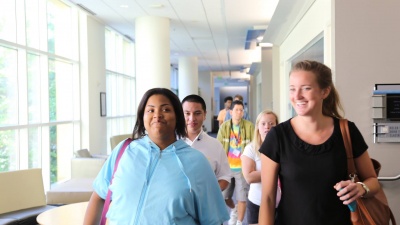Natalie Jackson (left) and Marnie Williams, followed by other Excel students, make their way to the Institute for Leadership and Entrepreneurship, Excel’s home on the fourth floor of the Scheller College of Business.