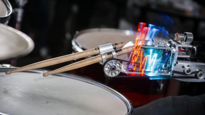 This robotic drumming prosthesis has motors that power two drumsticks. One is controlled by muscle sensors. The other is autonomous. 