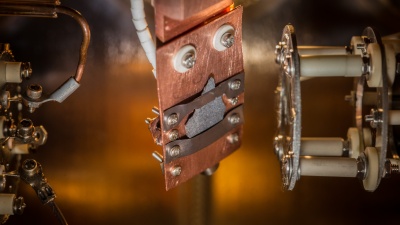 A lunar sample in a ultra-high vacuum system is hit with ultraviolet (157 nm) photons to simulate conditions in space.  