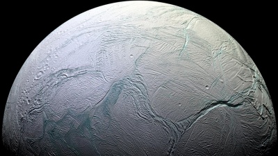 Under the thick ice crust of Saturn's moon Enceladus flows water. Could it harbor life? A new NASA-funded research alliance called Oceans Across Space and Time wants to know. Credit: NASA