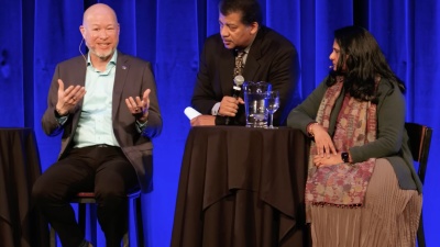 John Wise, left, speaks at the 2024 Asimov Debate