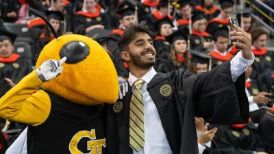 Student With Buzz at Commencement