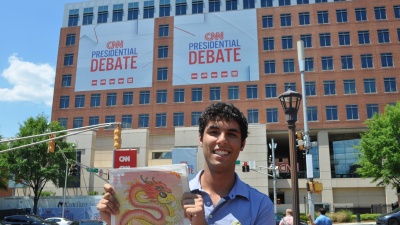 Alec Grosswald holds up a copy of the 'Technique' outside the Warner Media campus prior to the 2024 presidential debate. 
