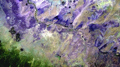 In the Painted Desert of Northern Arizona (shown here in a palette of purples), wet-dry cycling has contributed to the formation of the colorful layers visible in the landscape. (Credit: USGS)