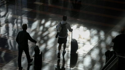 Passengers walk through the Ronald Reagan Washington National Airport on Nov. 7, 2025. Anna Moneymaker/Getty Images