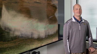 Researcher Michael Peterson with a visualization of the record lightning flash