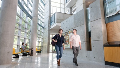 Graduate students walk through the lobby of the J. Erskine Love Jr. Manufacturing Building.