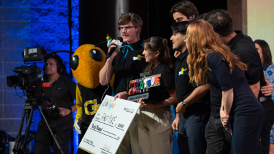 Team Hearo hold their prize after winning first place at the 2026 InVenture Prize competition.