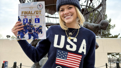 McLain Broussard outside of the United States Olympic and Paralympic Committee headquarters in Colorado Springs, Colorado, with one of her graphics from the 2026 Milan Cortina Winter Olympics. Submitted photo.