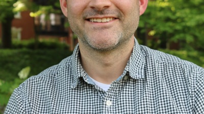 Headshot of a smiling man